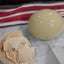 Ostrich Eating Egg
